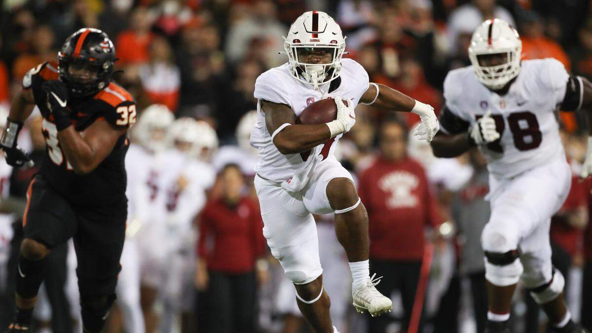 Stanford running back Nathaniel Peat (8) rushes 18 yards for a touchdown during the second half of an NCAA college football game against Oregon State on Saturday, Nov. 13, 2021, in Corvallis, Ore. Oregon State won 35-14. (AP Photo/Amanda Loman)