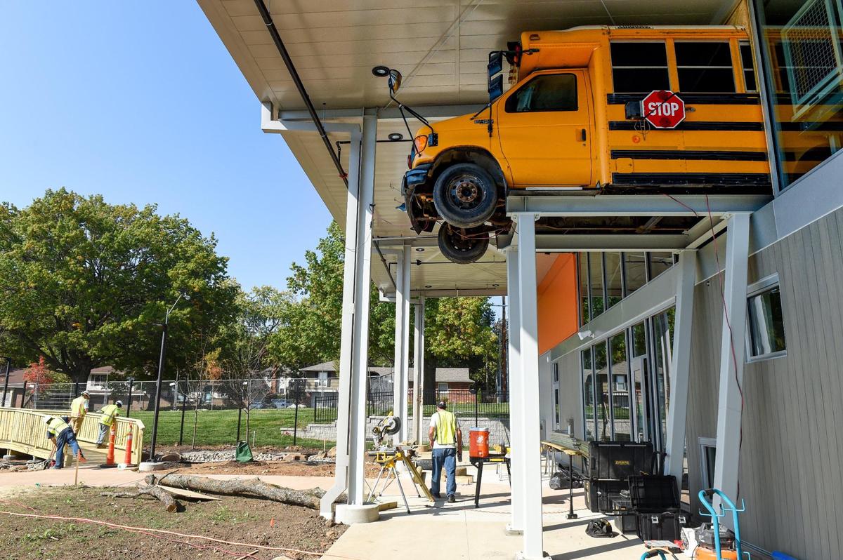 Children will be able to sit in the driver’s seat of a school bus that seems to be heading out of the second floor of Wonderscope. Below, employees were preparing NatureScope outdoor area.