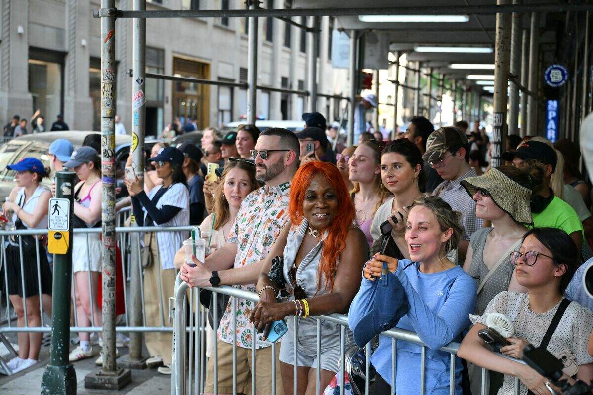Fans stand outside Madison Square Garden.