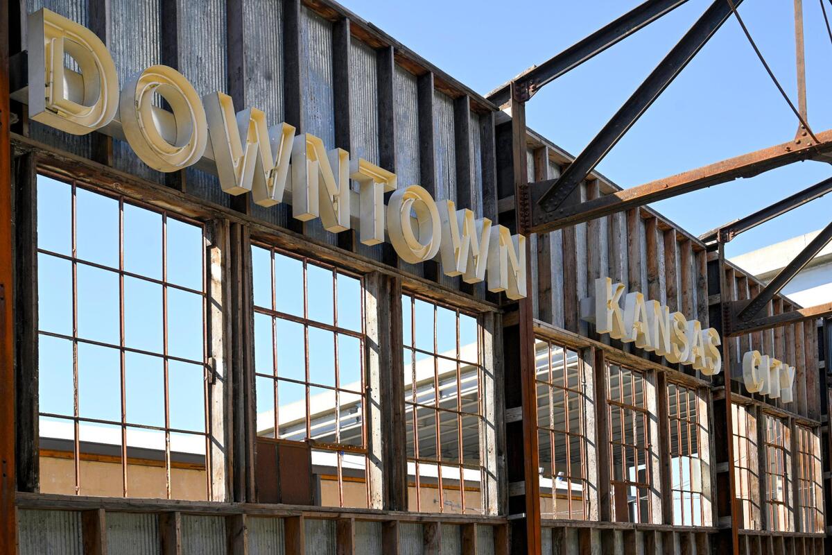 A blue neon sign from what was once called the Kansas City Downtown Airport is mounted atop what was planned to be the Talegate Beer Garden building at Pennway Point.
