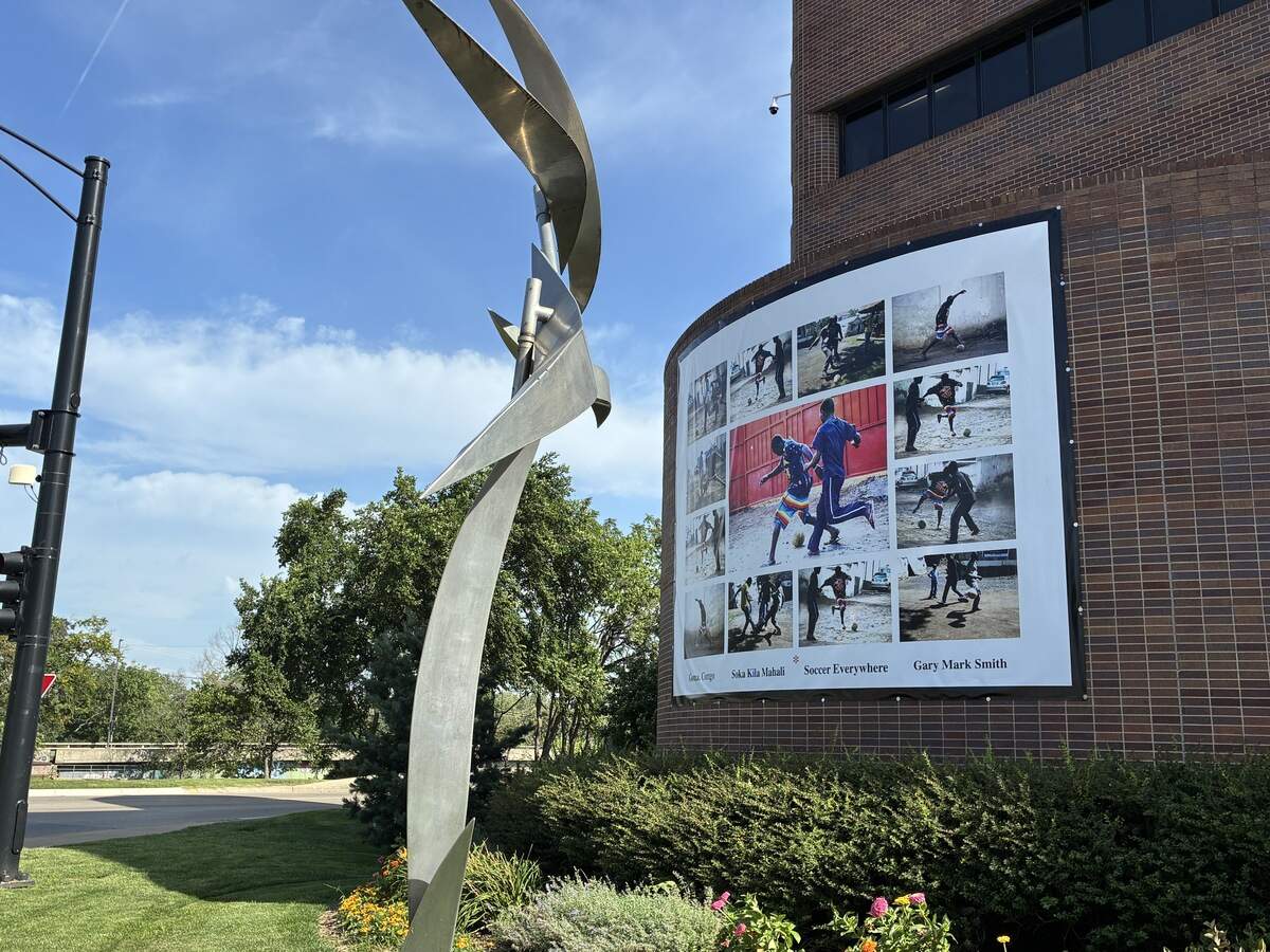 Photographs of soccer displayed on the outside of Lawrence City Hall. The town is considering making a bid for sister city status with communities in Algeria, following the team’s stay in Lawrence during the World Cup.