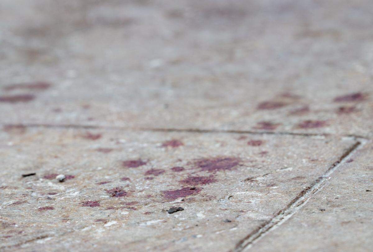 Blood was visible outside of the entrance at 2801 Southwest Blvd. following an early morning shooting on Sunday, Feb. 15, 2026. Two women were killed and two others injured during the incident at a Kansas City nightclub.