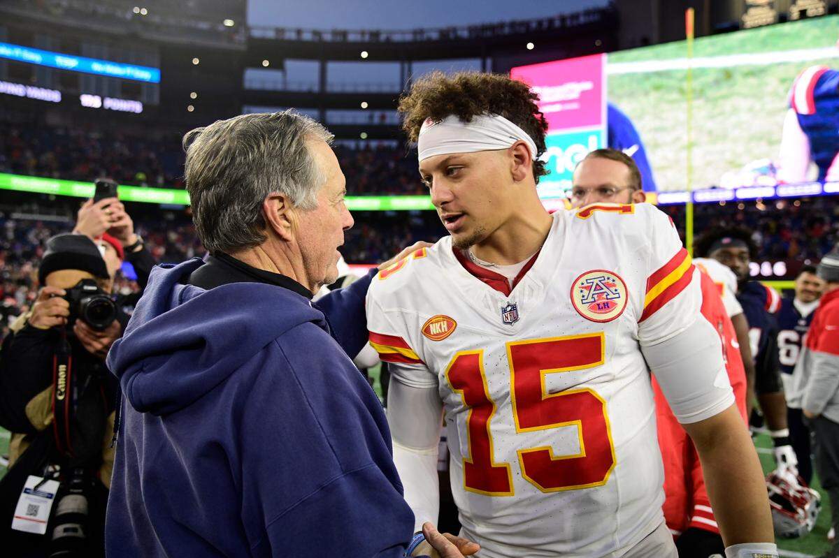 Chiefs quarterback Patrick Mahomes, right, shakes hands with New England Patriots coach Bill Belichick after Sunday’s game at Gillette Stadium in Foxborough, Mass.
