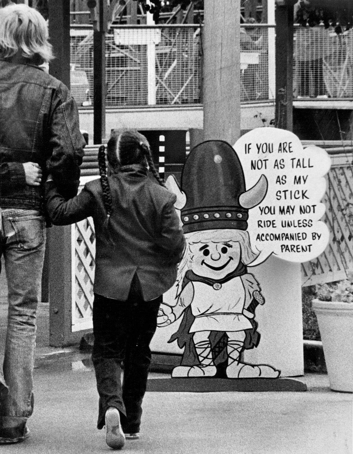 An early version of the “tall enough to ride” sign uses an image of a Viking.