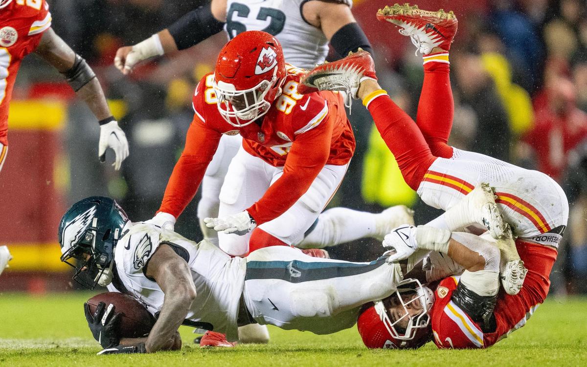 Kansas City Chiefs linebacker Drue Tranquill (23) tackles Philadelphia Eagles running back D’Andre Swift (0) during an NFL football game on Monday, Nov. 20, 2023, at GEHA Field at Arrowhead Stadium in Kansas City.