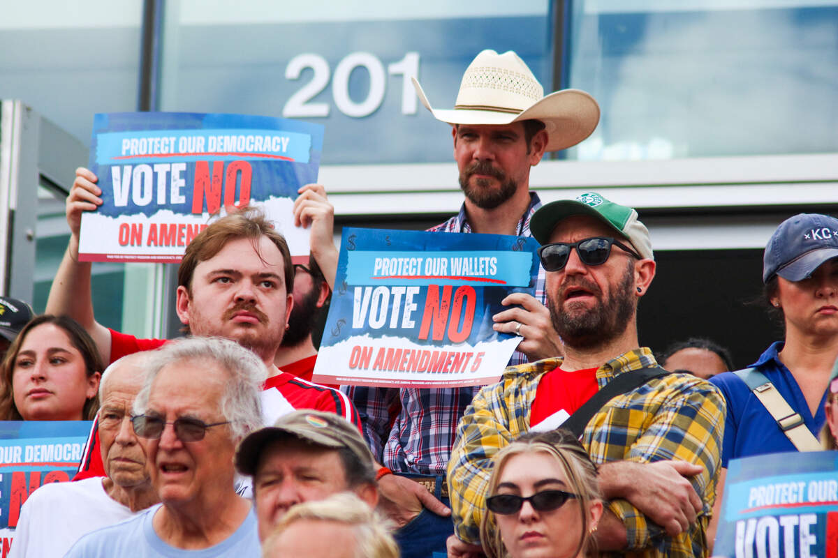 Kansas City voters rally outside Westport Presbyterian Church on Saturday, July 18 to oppose two statewide ballot measures, amendments 4 and 5. Speakers shared their thoughts about why they opposed the measures during the rally.