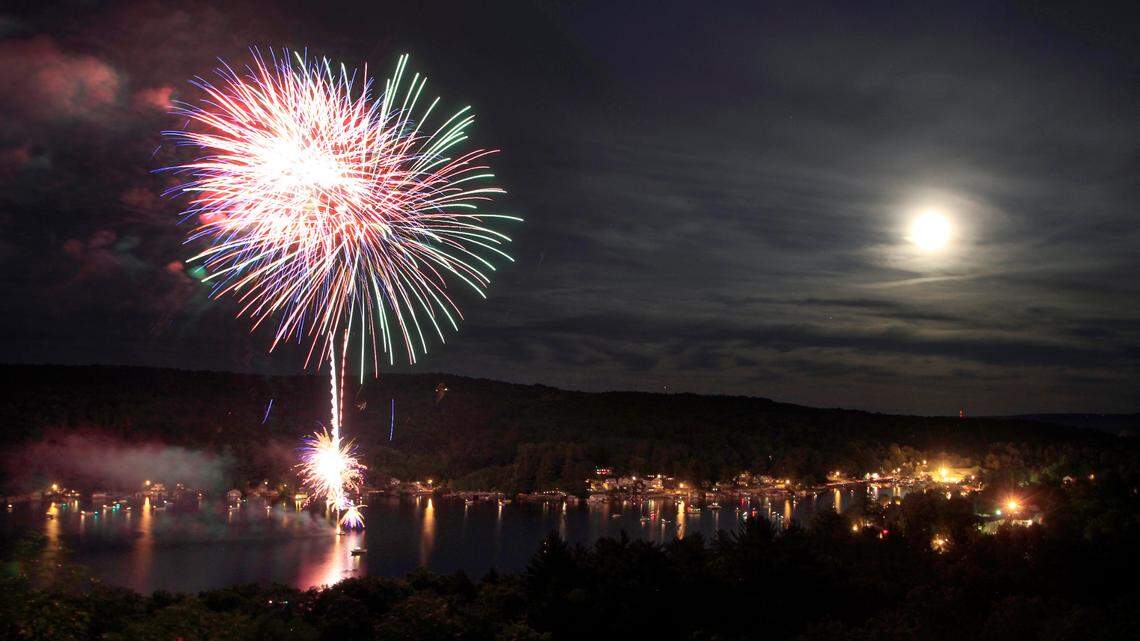 File photo of fireworks over a lake. A 28-year-old Michigan man was killed while lighting a firework in memory of a friend on Feb. 22, officials say.
