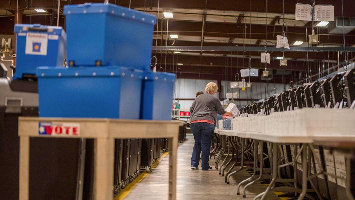 Election workers sort out voter ballots into plastic bins at the Johnson County Election Office on Tuesday, Aug. 16, 2022, in Olathe. Kansas’ largest counties will undergo a recount from the Aug. 2 election in an attempt by Value Them Both supporters to overturn the state’s vote in favor of abortion rights.