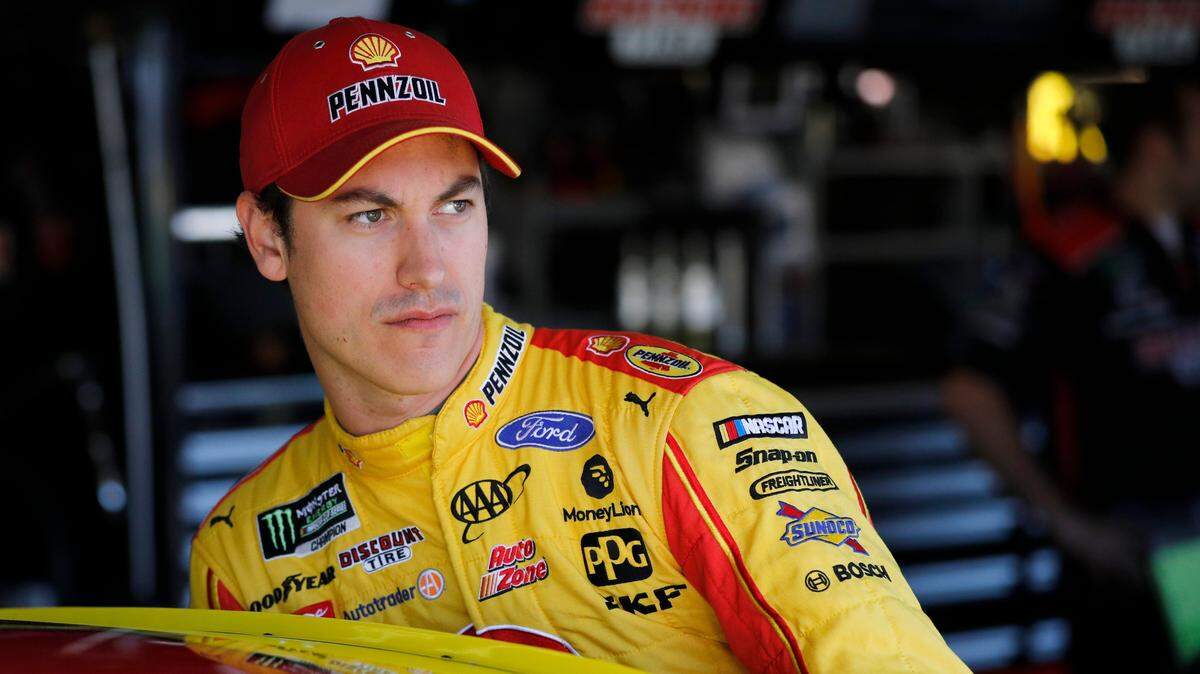 Joey Logano climbs into his car during practice for a NASCAR Cup Series auto race at Kansas Speedway in Kansas City, Kan., Friday, Oct. 18, 2019. (AP Photo/Colin E. Braley)
