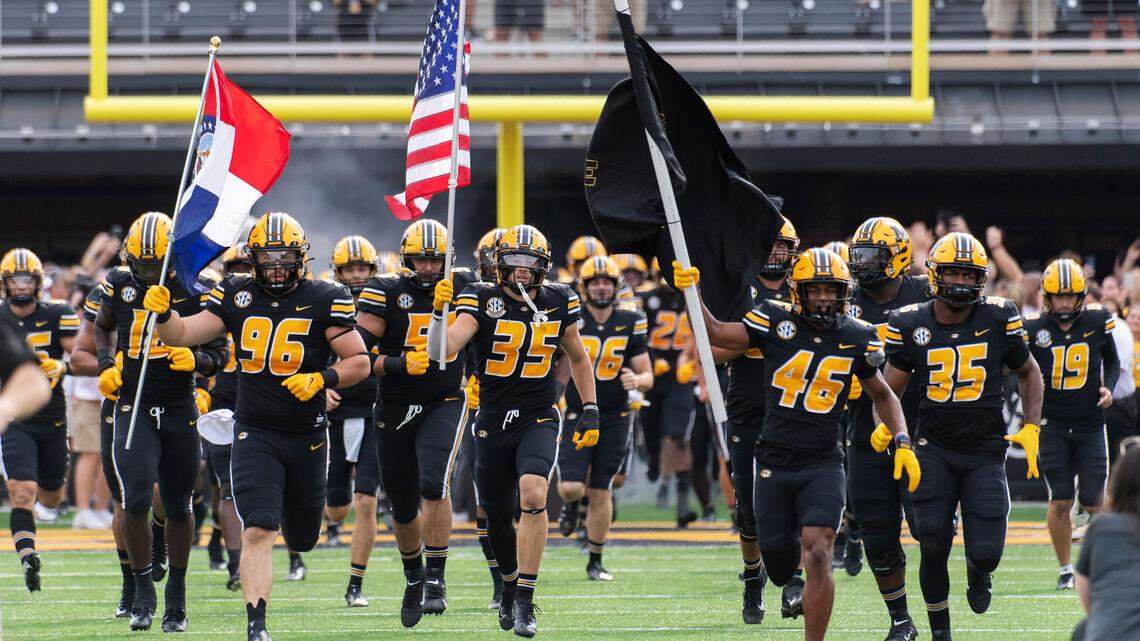 The Missouri Tigers football team runs onto the field before the start of Saturday’s homecoming game against North Texas on Saturday, Oct. 9 in Columbia.