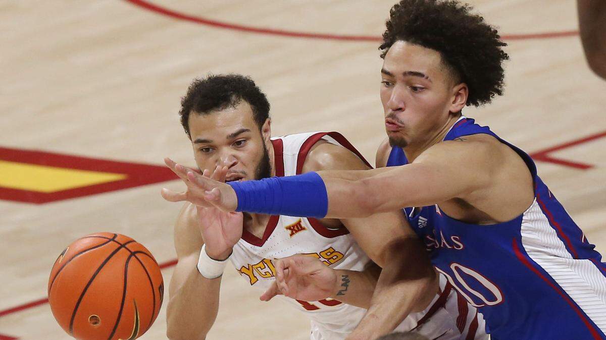 Iowa State Cyclones guard Jaren Holmes (13) steals the ball from Kansas Jayhawks forward Jalen Wilson (10) during the second half at Hilton Coliseum Saturday, Feb. 4, 2023, in Ames, Iowa.