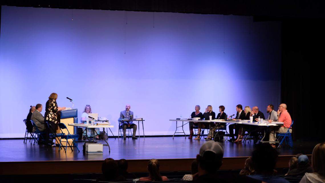 John Magoffin, center, testifies during a hearing at Harrisonville High School.