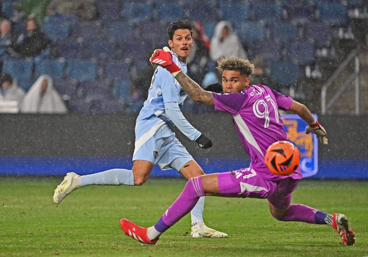 Sporting Kansas City forward Daniel Salloi (10) shoots the ball past Minnesota United goalkeeper Dayne St. Clair (97) for a goal in the second half at Children’s Mercy Park on March 15, 2025.