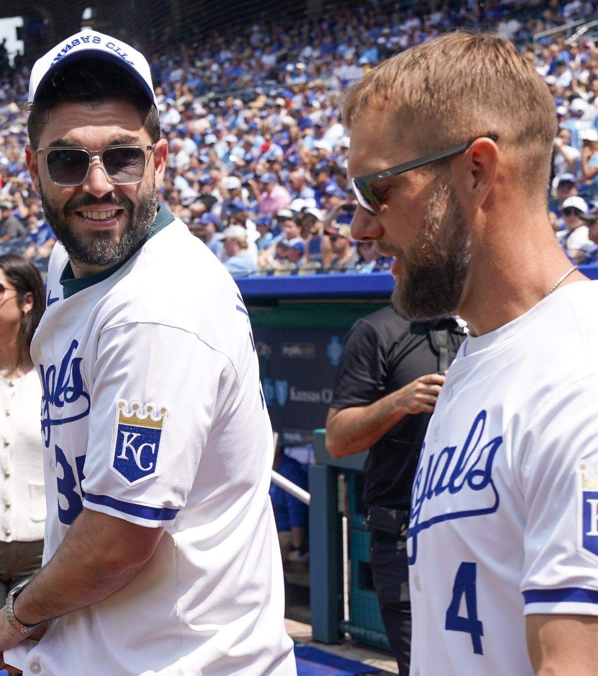 Former Royals teammates Eric Hosmer, left, and Alex Gordon walk onto the field at Kauffman Stadium for Mike Moustakas’ official retirement ceremony on May 31, 2025 in Kansas City.