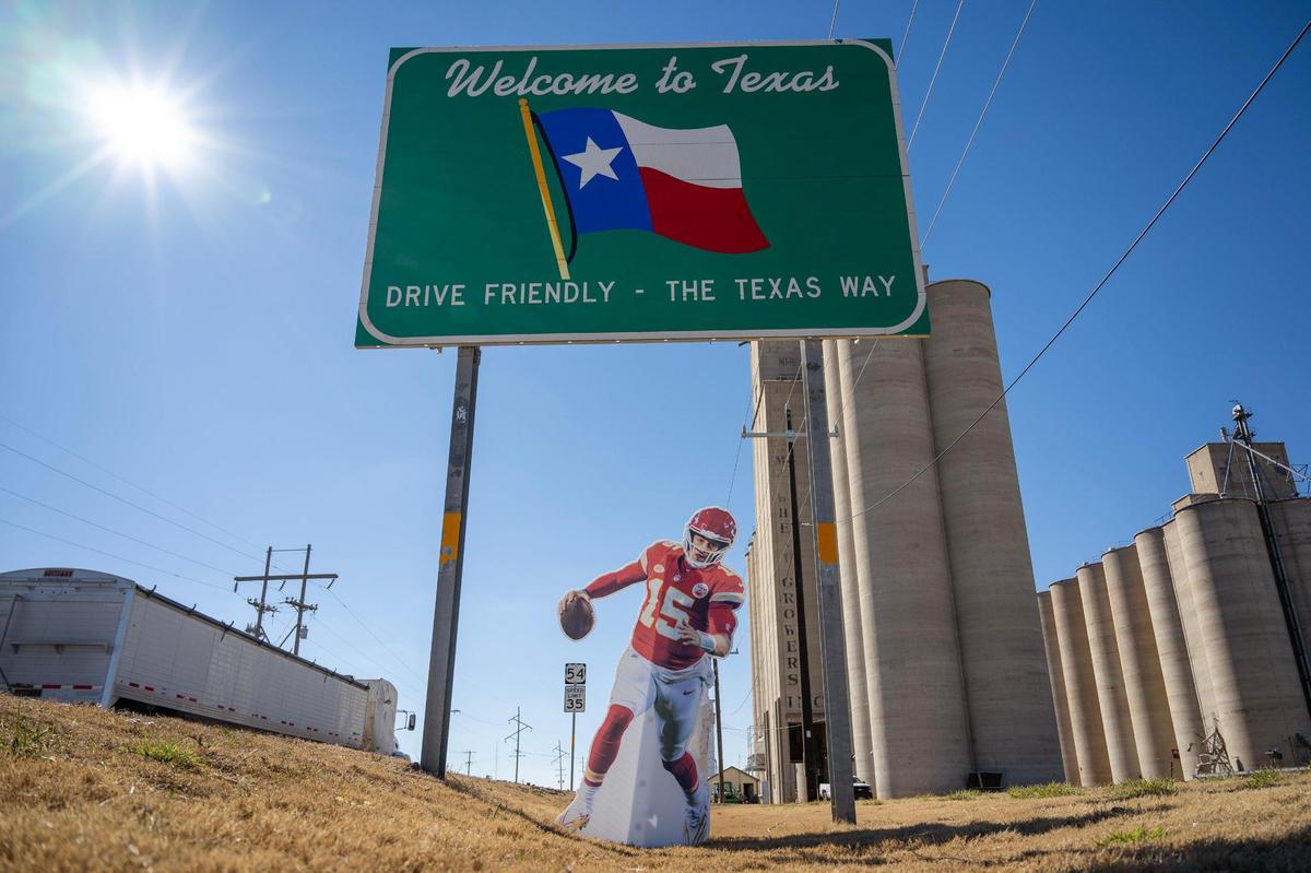 A life-size cutout featuring Kansas City Chiefs quarterback Patrick Mahomes stands next to a Texas welcome sign on Monday, Feb. 5, 2024, in Goodwell, Texas.