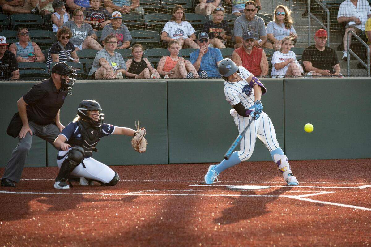 Smash It Vipers first baseman Shelbi Sunseri hits the ball as the USSSA Pride take on the Smash It Vipers in the inaugural opening day game for the WPF in at the Shawnee Mission Softball Complex in Shawnee KS, on June 14, 2022.