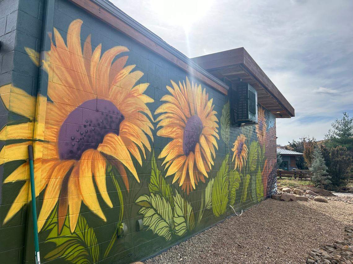 The side of Station 3 is now covered with a sunflower mural, but at one time, a garage door allowed fire trucks in and out.