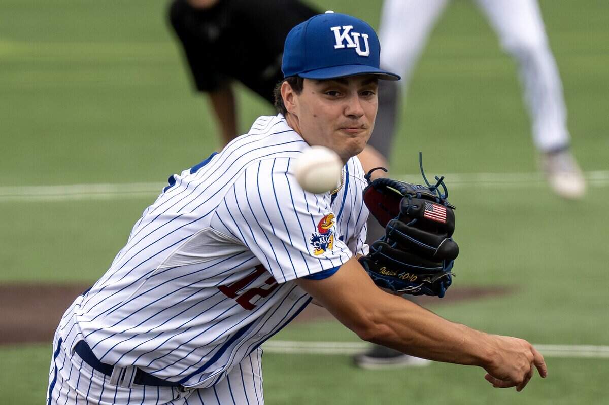 Kansas Jayhawks pitcher Dominic Voegele (12) throws in the fourth inning against the Oklahoma Sooners during an NCAA baseball tournament game at Hoglund Ballparkon Saturday, June 6, 2026, in Lawrence.