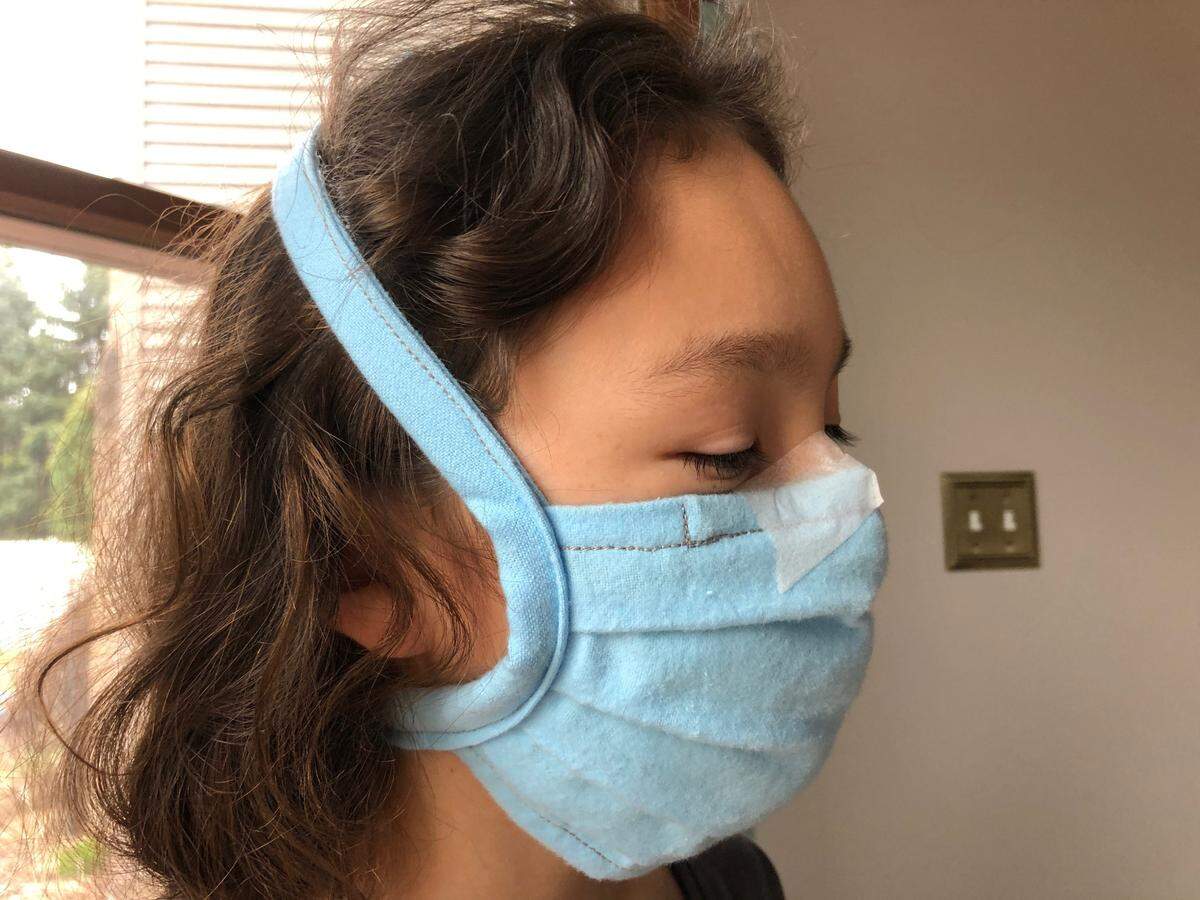 Dr. Wei-Shin Lai in Erie, Pennsylvania, designed a homemade mask at the beginning of the pandemic and shared the instructions online. She wears glasses and uses surgical tape to seal the mask to her face and prevent the glasses from fogging.