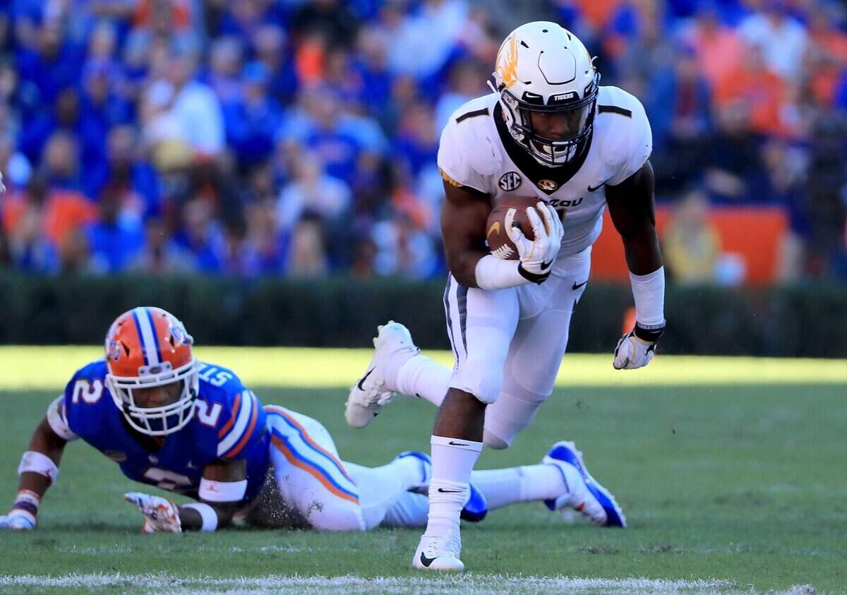 Tyler Badie #1 of the Missouri Tigers rushes for yardage during the game against the Florida Gators at Ben Hill Griffin Stadium on November 3, 2018 in Gainesville, Florida.