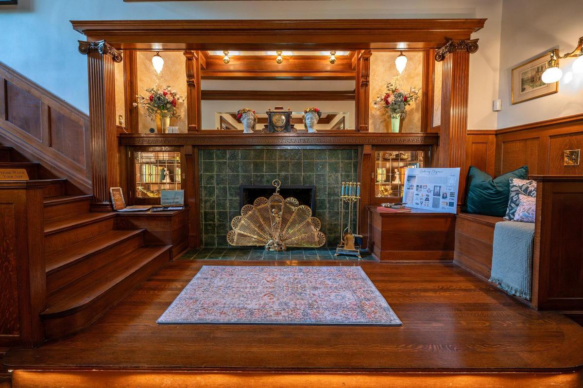 The fireplace near the entryway of the 55th Symphony Designers’ Showhouse features an original tile known as “Kansas City green.”