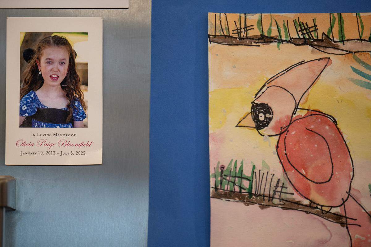 A photo of Olivia Bloomfield hangs on the refrigerator at the family's home in Leawood. In her ten years, Olivia was a champion for accessibility and inclusion in the Kansas City area. She was born with Congenital Muscular Dystrophy and passed away on July 5, 2022. A foundation, Olivia Bloomfield Foundation, run by her mother, Sara Bloomfield, carries on her mission and legacy.