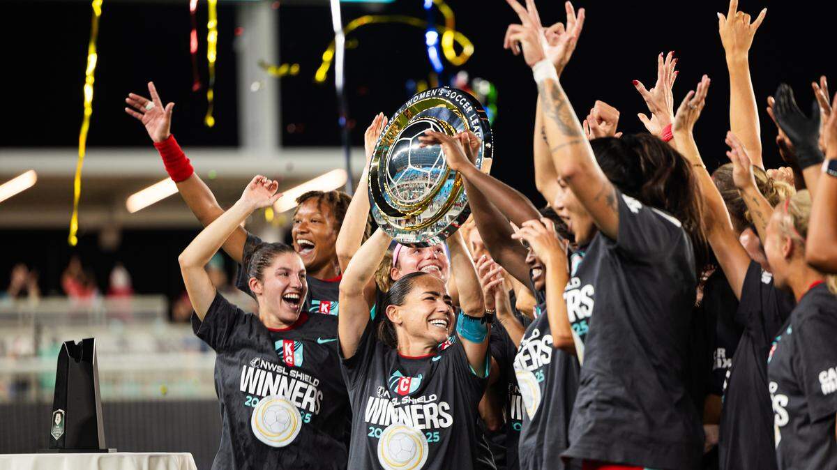 Kansas City Current players celebrate with the NWSL Shield, awarded to the National Women’s Soccer League club with the best record, after beating the Seattle Reign 2-0 at CPKC Stadium in Kansas City. It’s the first major trophy for the KC Current.