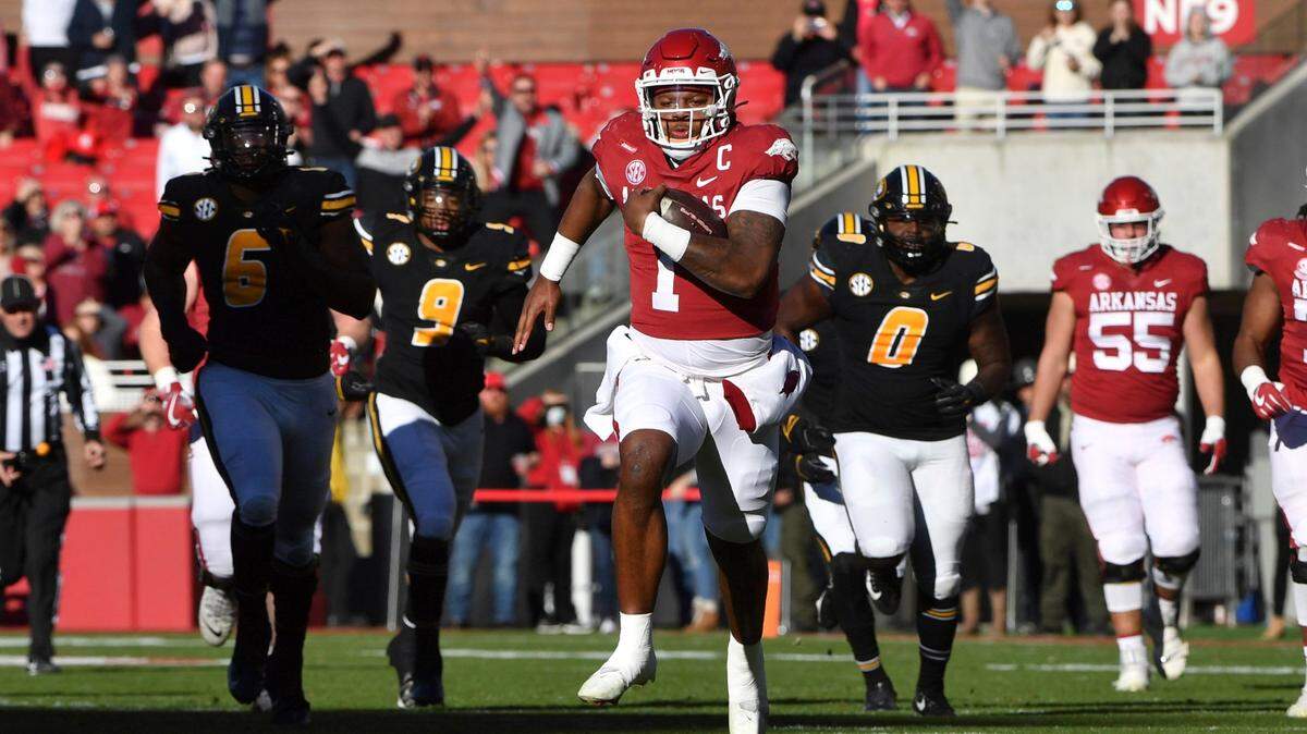 Arkansas quarterback KJ Jefferson (1) breaks through the Missouri defense as he runs for a big gain during the first half of an NCAA college football game Friday, Nov. 26, 2021, in Fayetteville, Ark. (AP Photo/Michael Woods)