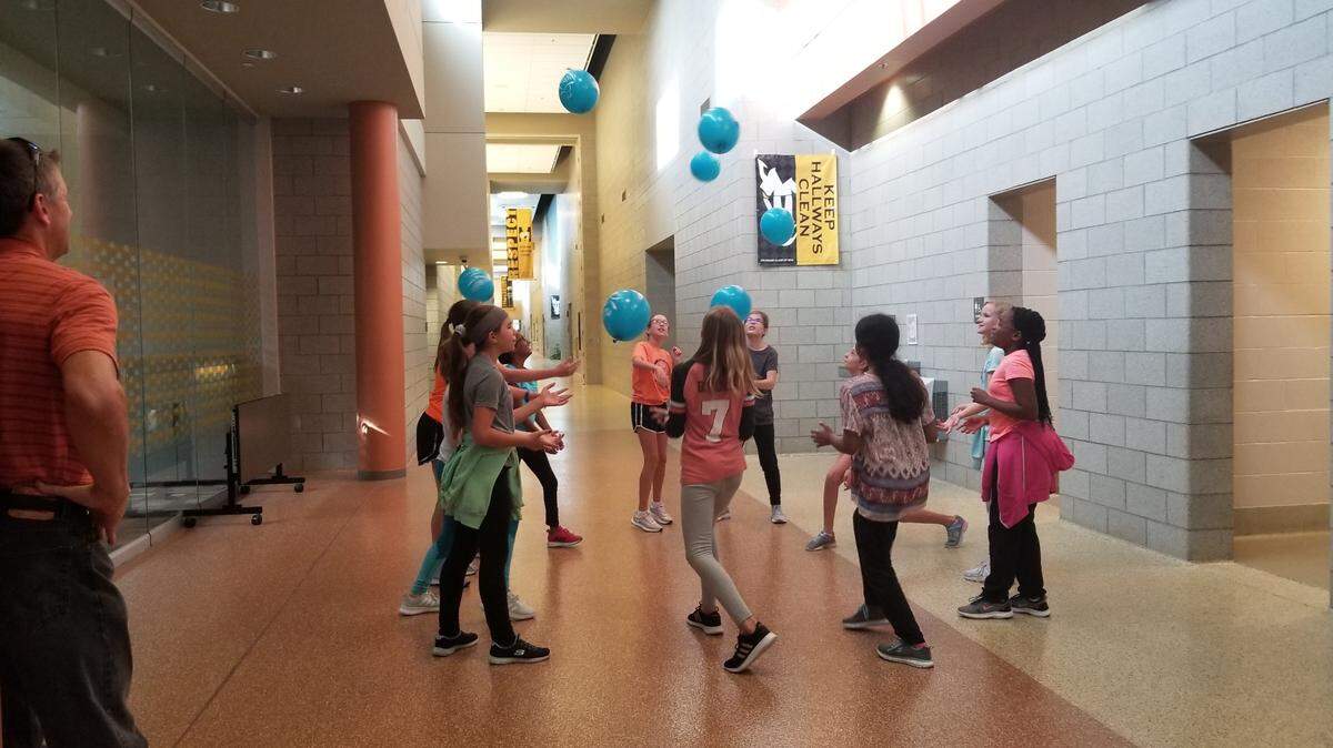 A Girls on the Run group does an activity in 2019 in Merriam.