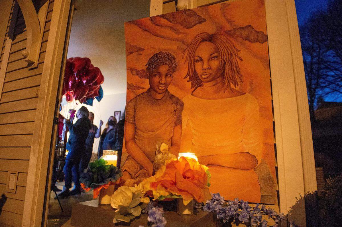 Friends and families of Khasheme Strother and her son, Raymon Hill, gathered Monday night, Feb. 22, for a balloon release vigil in remembrance of the pair who were shot near the 1900 block of W. Pennway Terrace in a double homicide Wednesday in Kansas City.