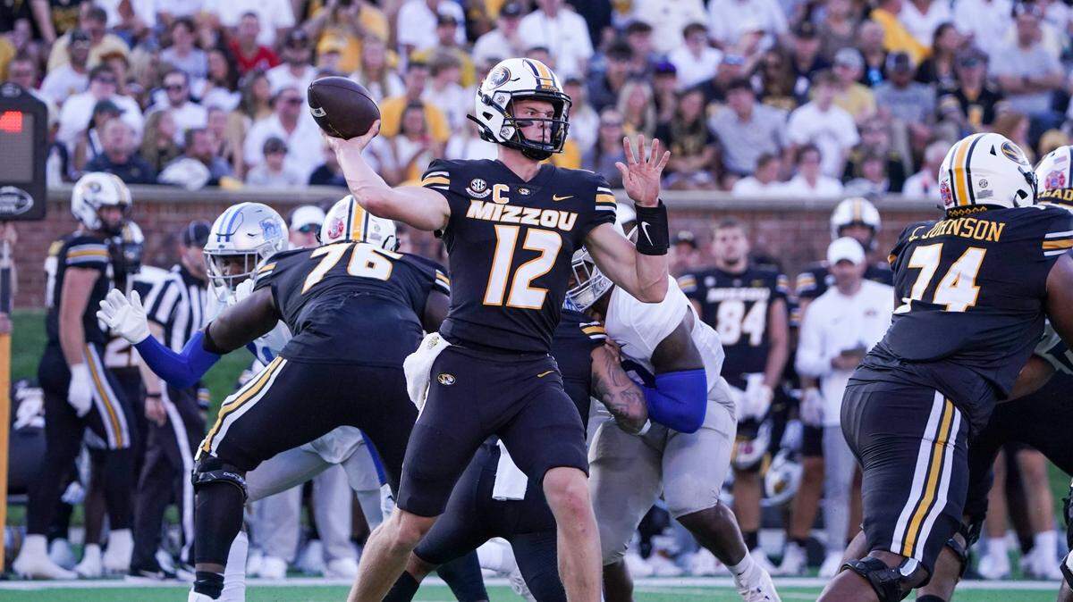 Missouri Tigers quarterback Brady Cook (12) throws a pass against the Middle Tennessee Blue Raiders during the first half at Faurot Field at Memorial Stadium on Sept. 9, 2023.