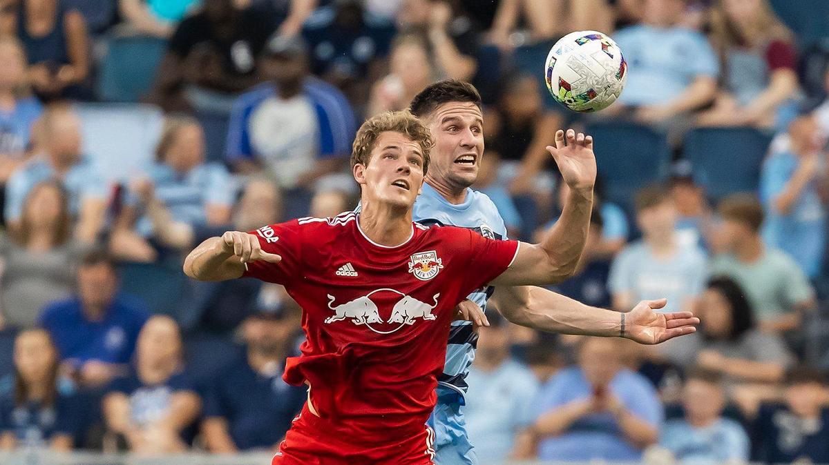 New York Red Bulls forward Tom Barlow, front, and Sporting Kansas City defender Andreu Fontàs battle for the ball during the teams’ match Sunday night at Children’s Mercy Park in Kansas City, Kansas.