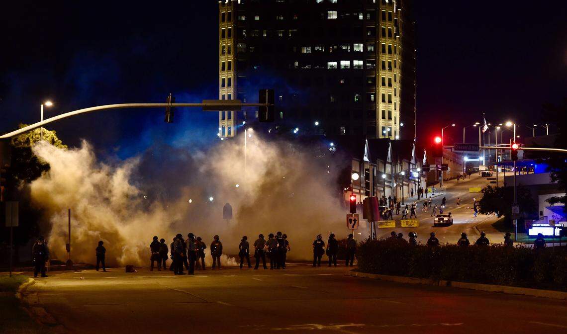 Kansas City police deployed tear gas Monday night against protesters near the Country Club Plaza.