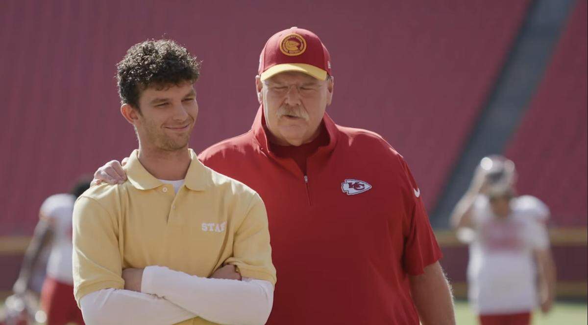 Austin Senger with Chiefs head coach Andy Reid in their Snickers commercial.