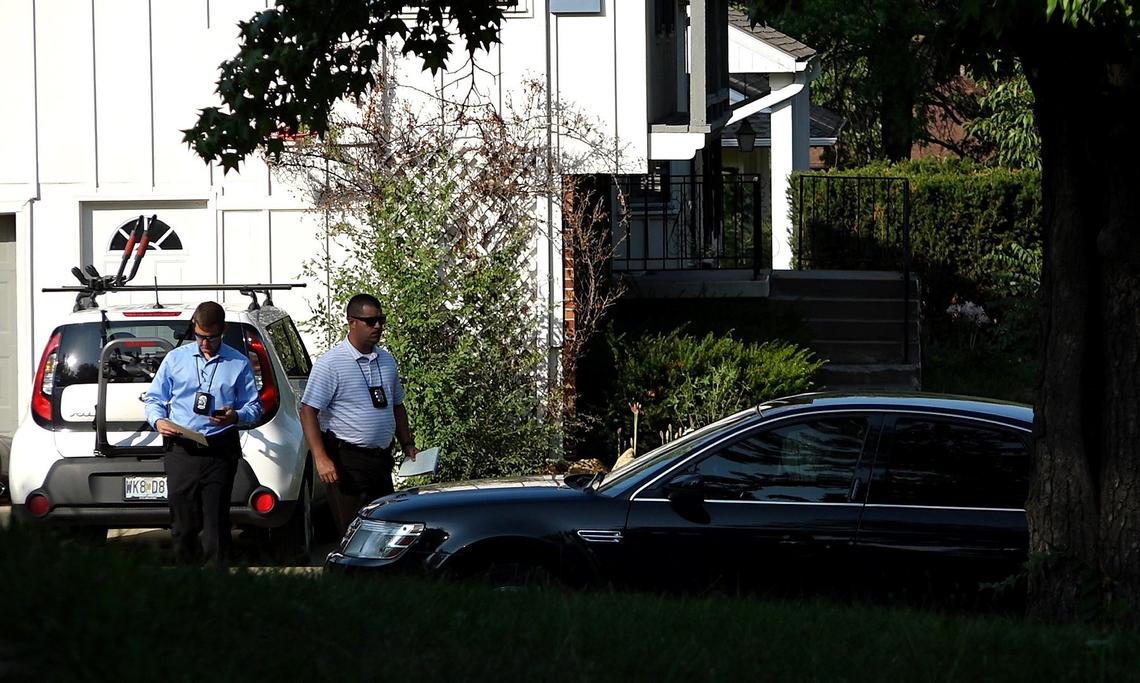 Witnesses say Xindong Hao was killed in front of this house on Bridge Manor Drive on Wednesday night. On Thursday, detectives continued their investigation there.