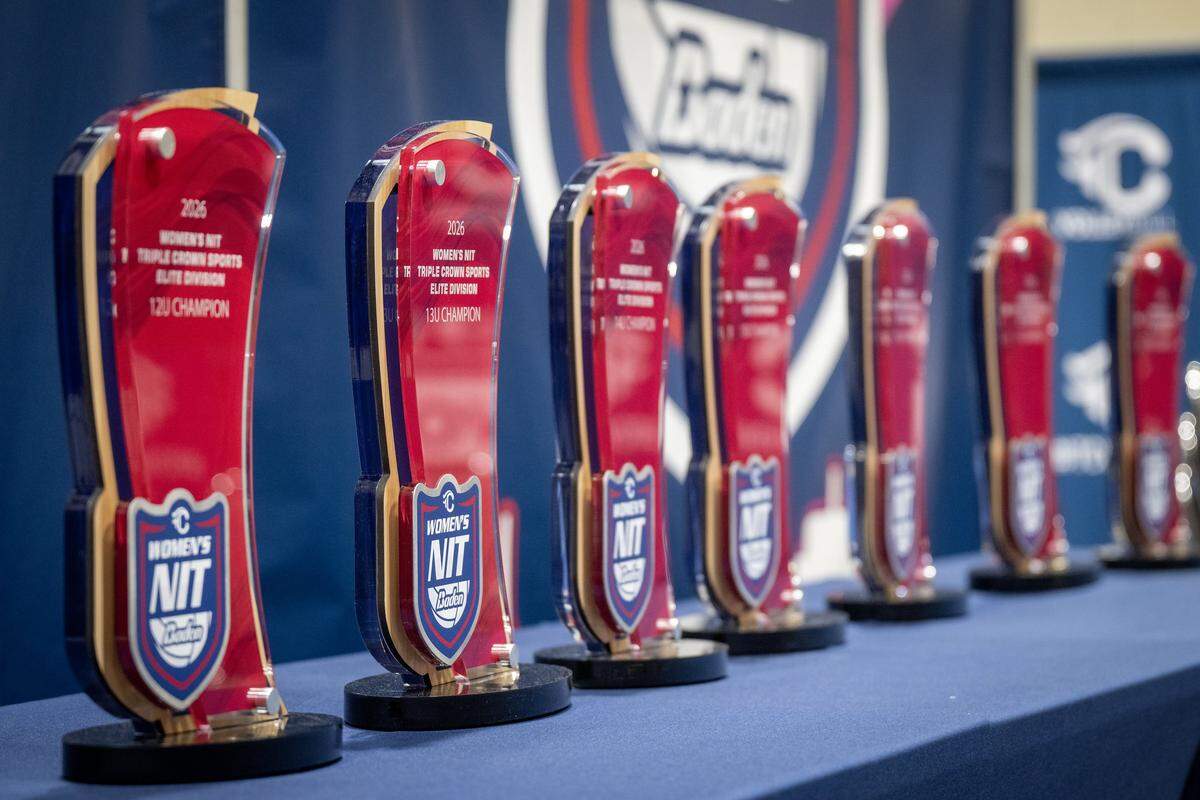 Trophies for the Triple Crown NIT line the tables at the Kansas City Convention Center on Sunday, Feb. 15. This elite youth volleyball showcase has drawn 687 teams and 40,000 fans to the city, with the final awards set to be handed out this Monday.