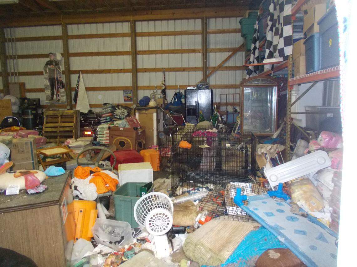 An Ohio woman pleaded guilty to 13 animal cruelty charges after police found 30 dead dogs in freezers and 90 in cruel conditions, cops say. (Butler County Police Facebook)