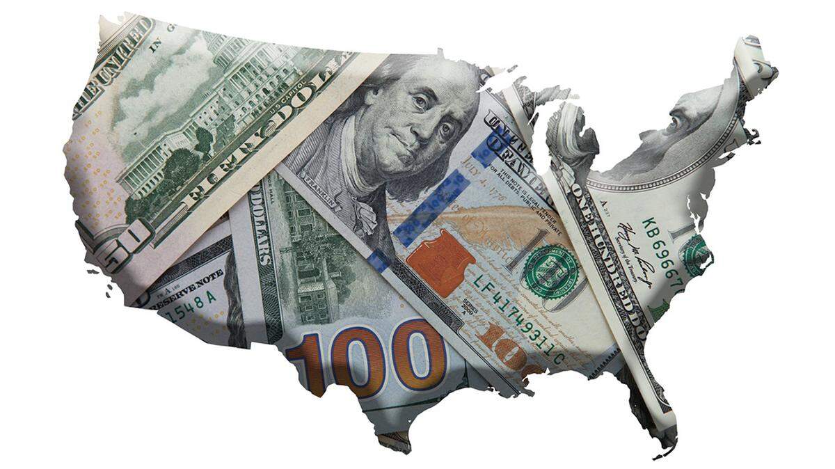 Various Dollar notes over U.S contour map national debt united states money budget crisis