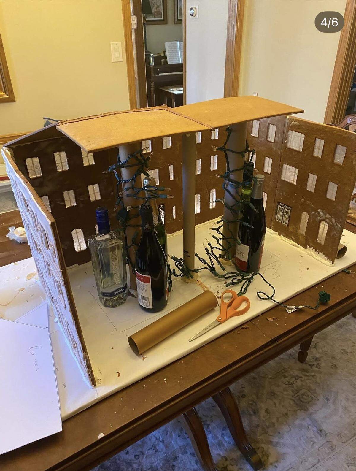 Tobiason uses wine bottles and other tall items from around the house to prop the walls.