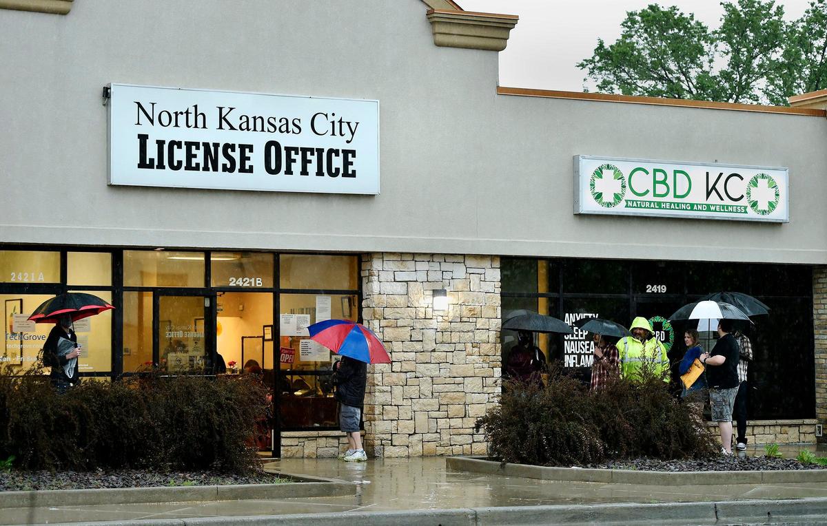 People waited outside the North Kansas City License Office in May 2020.