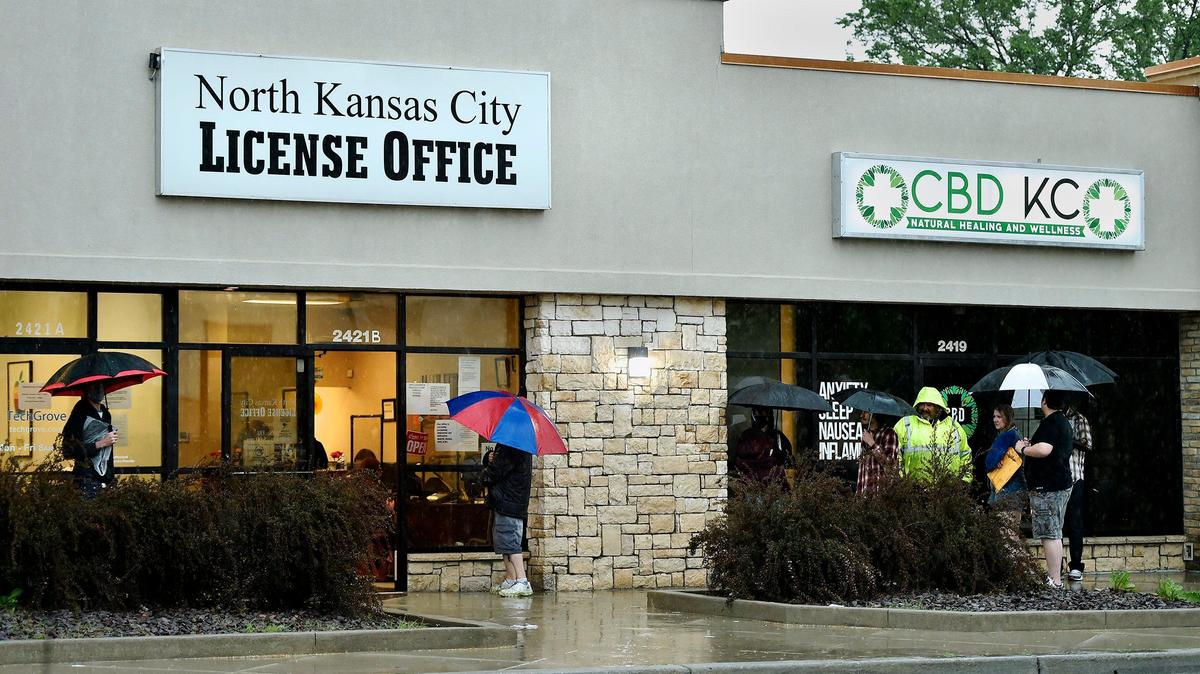 People waited outside the North Kansas City License Office in May 2020.