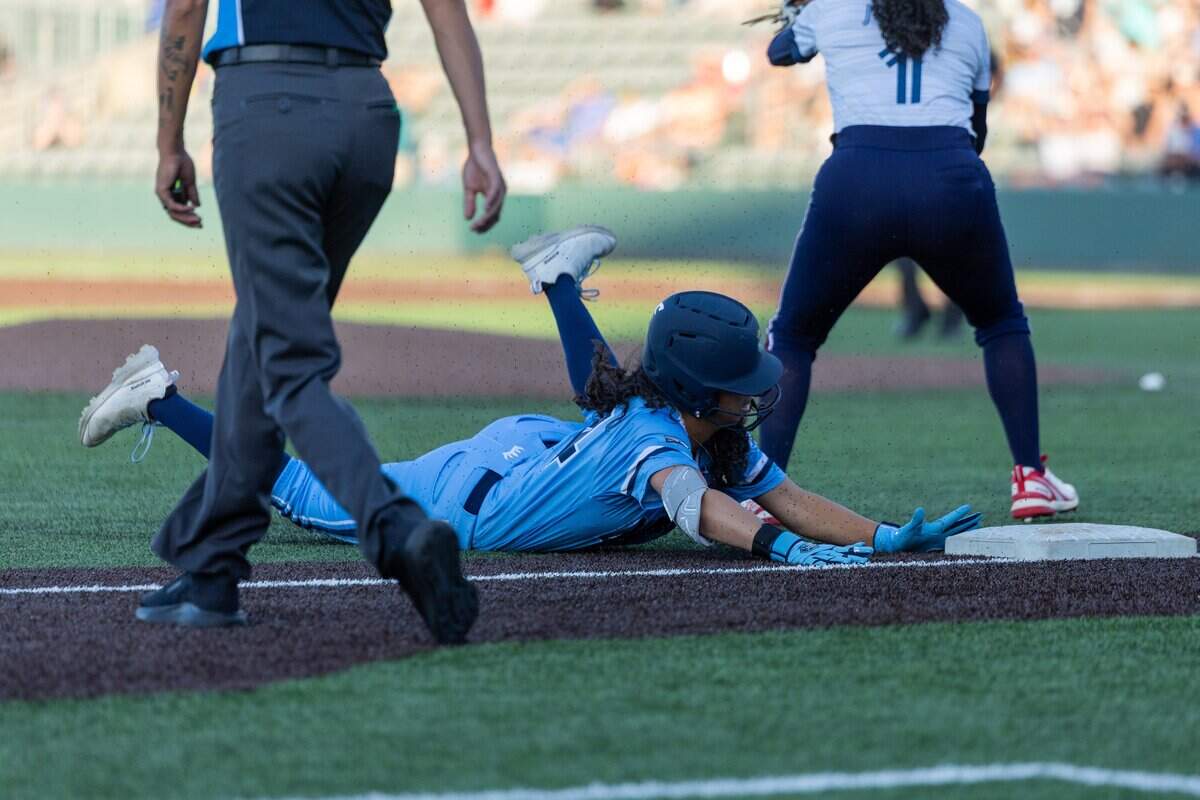 Outfielder Alexis Hastings, #14, slides headfirst into third base during the KC Diamonds home opener at Legends Field on Wednesday, June 17, 2026.