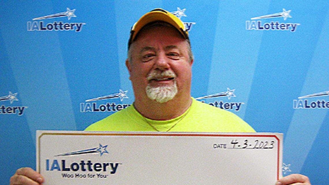 Michael Burris with his oversized check.