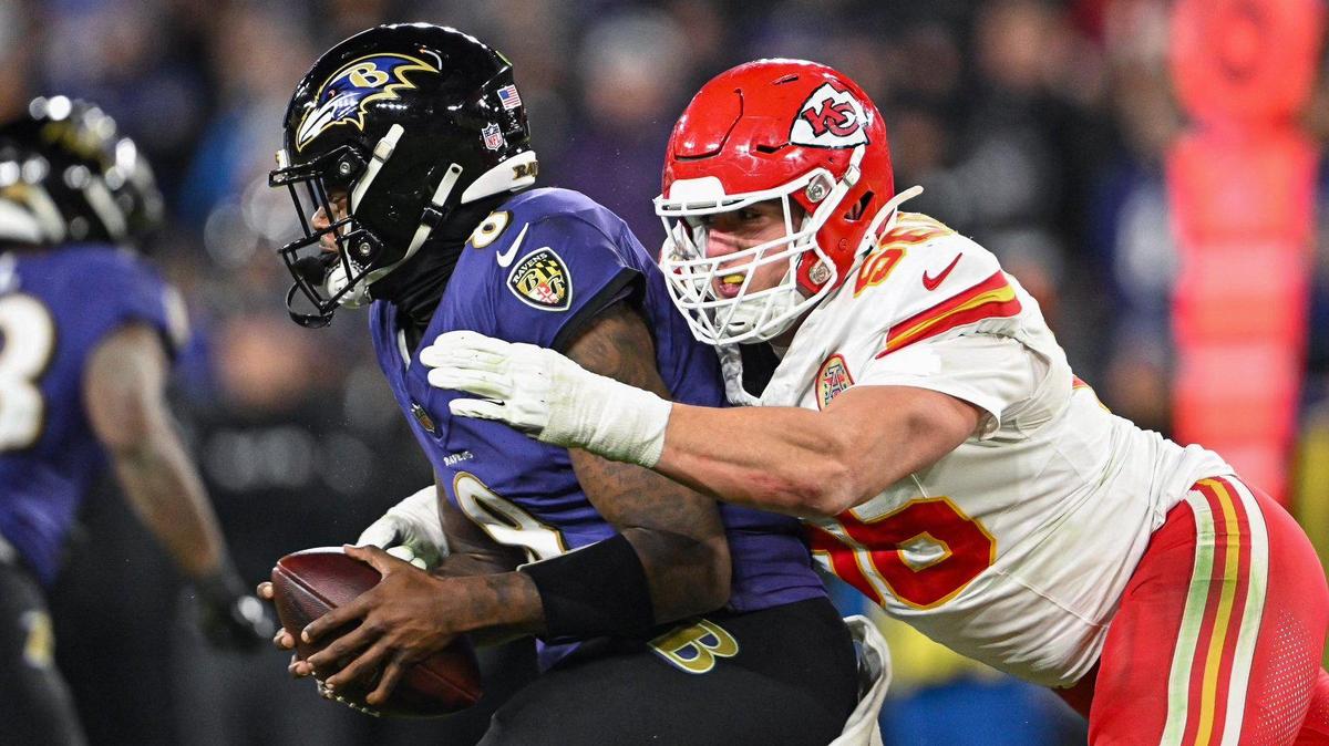 Kansas City Chiefs defensive end George Karlaftis (56) sacks Baltimore Ravens quarterback Lamar Jackson (8) in the fourth quarter Sunday, Jan. 28, 2024, during the AFC Championship Game in Baltimore.