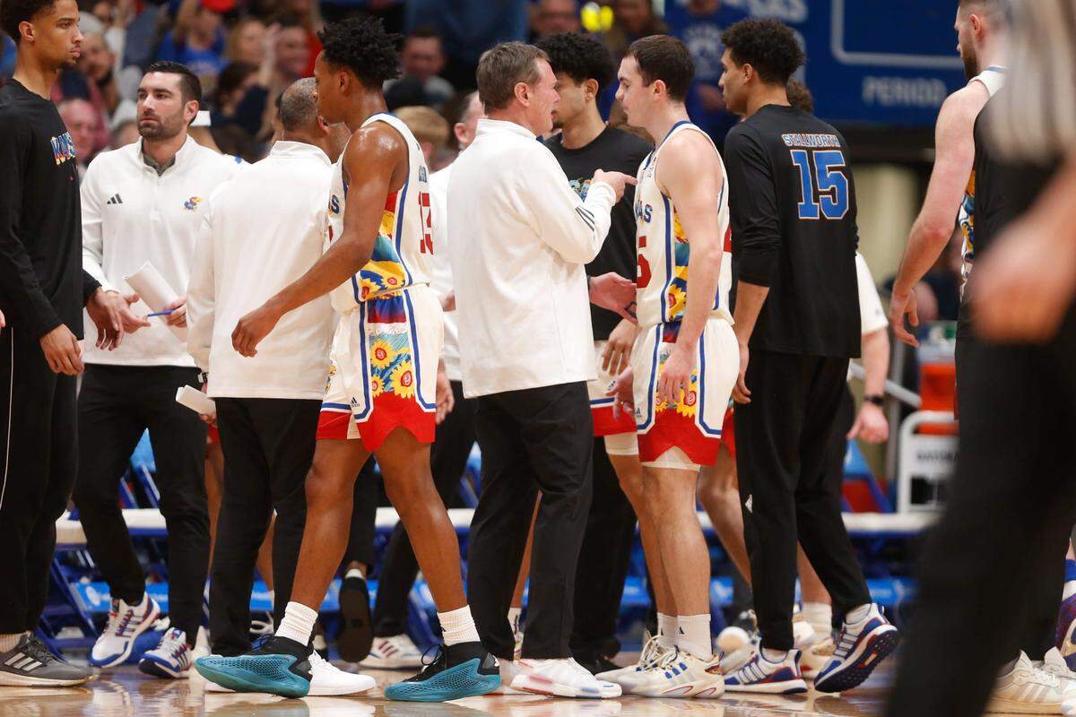 Kansas coach Bill Self talks with transfer guard Nicolas Timberlake (25) in the first half on Saturday, February 10, 2024, inside Allen Fieldhouse.