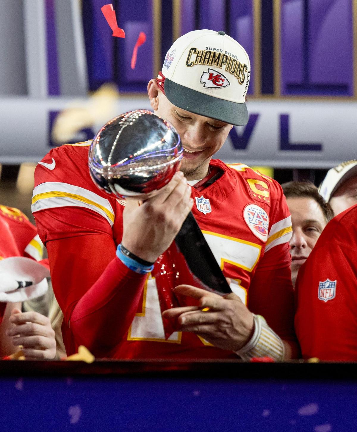 Kansas City Chiefs quarterback Patrick Mahomes (15) admires the Lombardi Trophy after the Chiefs defeated the San Francisco 49ers in overtime 25-22 in Super Bowl LVIII on Sunday, Feb. 11, 2024, in Las Vegas.