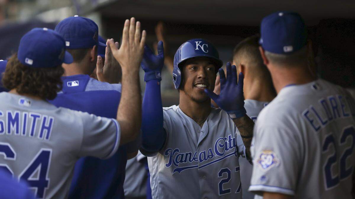 The Kansas City Royals' Adalberto Mondesi is congratulated in the dugout after his three-run home run in the second inning against the Minnesota Twins on Tuesday, July 10, 2018, at Target Field in Minneapolis.