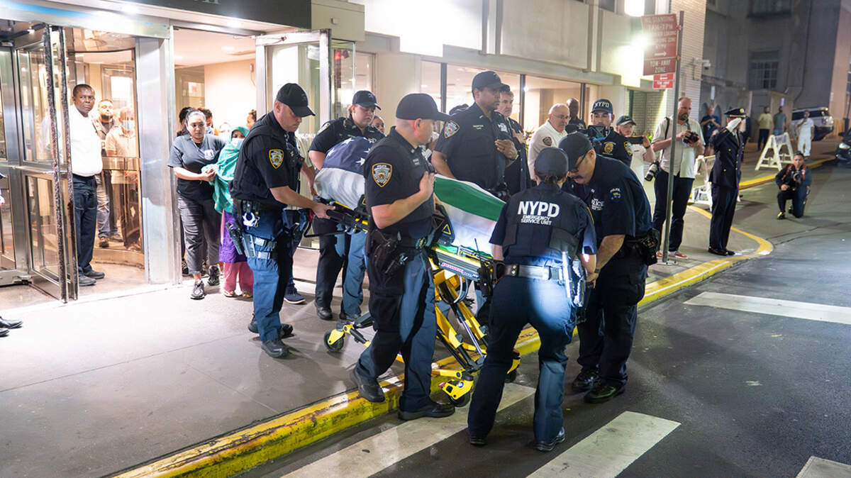 The body of New York Police Department officer Didarul Islam is transferred from New York Presbyterian Hospital.