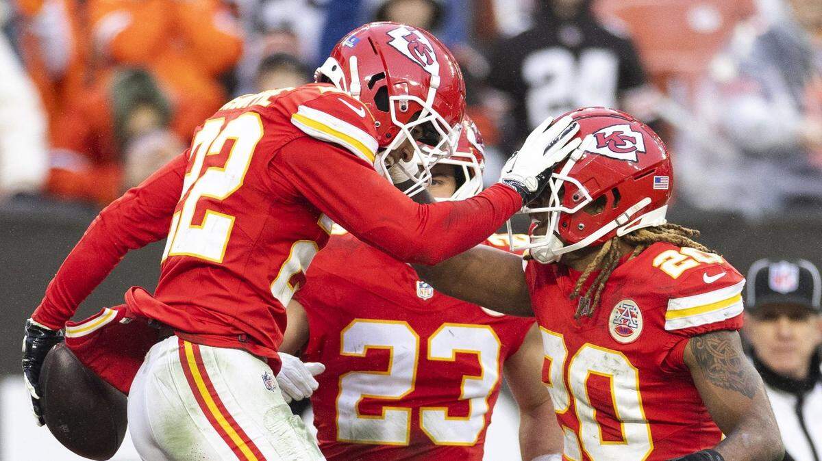 Dec 15, 2024; Cleveland, Ohio, USA; Kansas City Chiefs cornerback Trent McDuffie (22) celebrates his interception with teammates against the Cleveland Browns during the fourth quarter at Huntington Bank Field. Mandatory Credit: Scott Galvin-Imagn Images