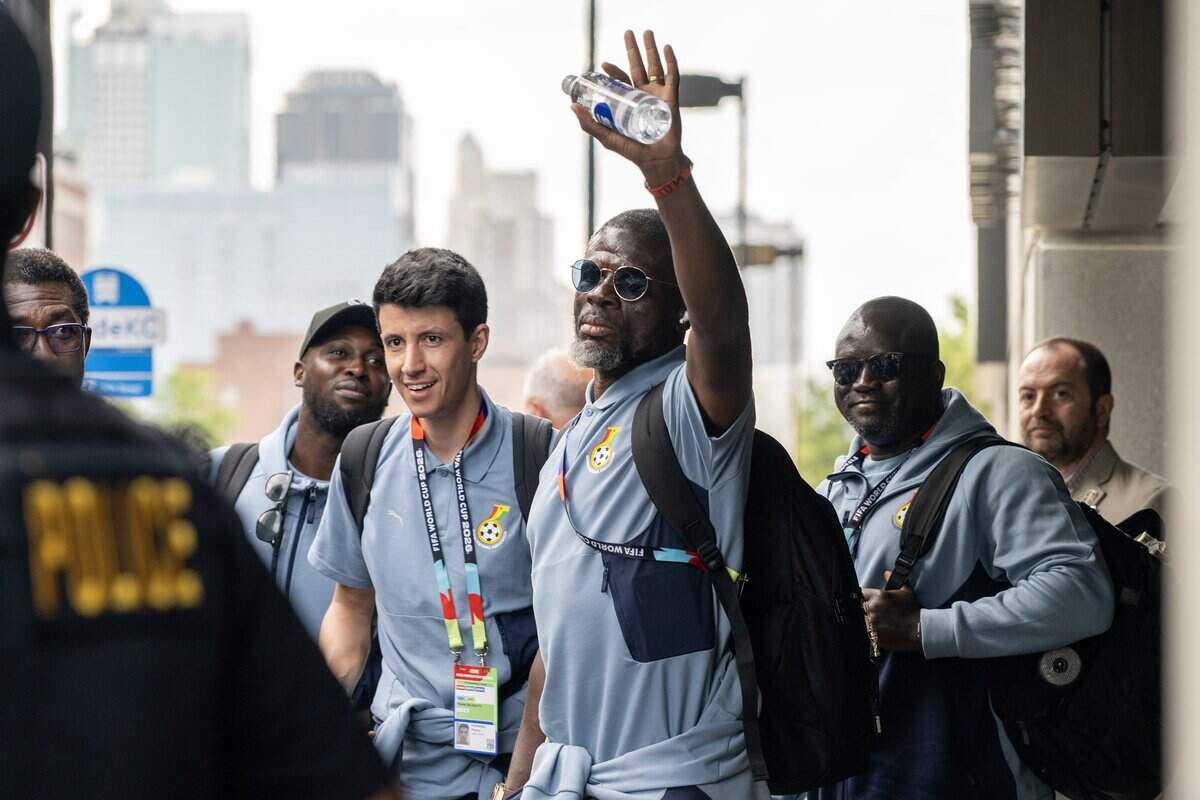 Ghana national team players wave to fans as they get off the bus outside the Sheraton Kansas City Hotel on Wednesday, July 1, 2026.
